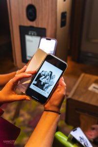 Guest holding a printed and digital copy of elegant photo booth photos from a Vancity photo booth setup with seamless mobile delivery.