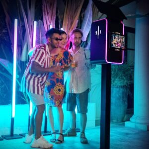 Guest poses at a resort photo booth rental in Vancouver with custom filters and elegant photo booth backdrop