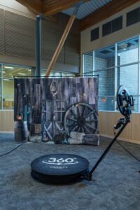 Rustic-themed photo booth backdrop and platform setup for a Vancity Photo Booth rental in Vancouver, featuring barn props and cinematic lighting.